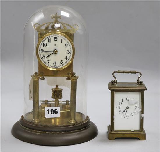 A French late 19th century gilt-brass carriage timepiece, H 5.75in and a brass torsion mantel timepiece under glass dome (2)